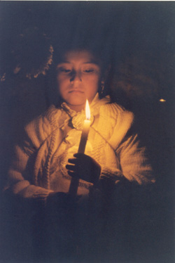 girl holding a light at a festival